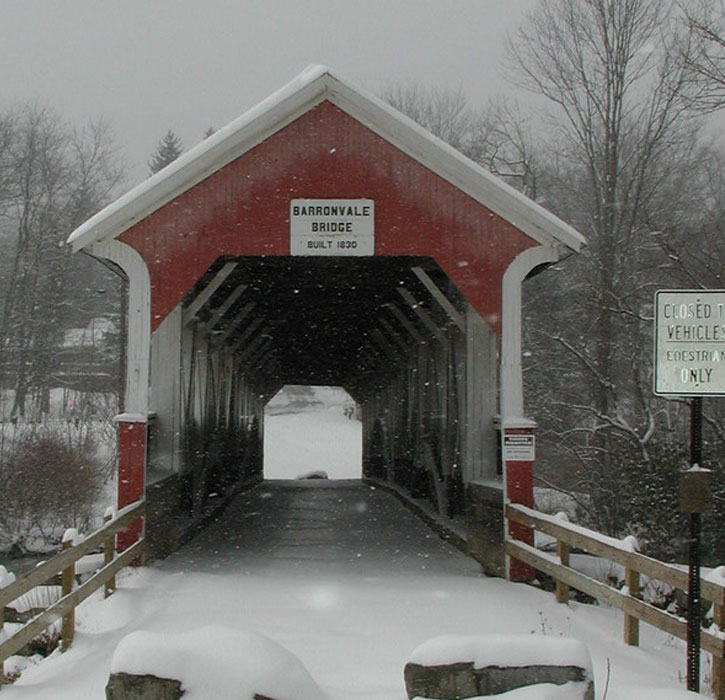 white and red covered bridge in Pennyslvania