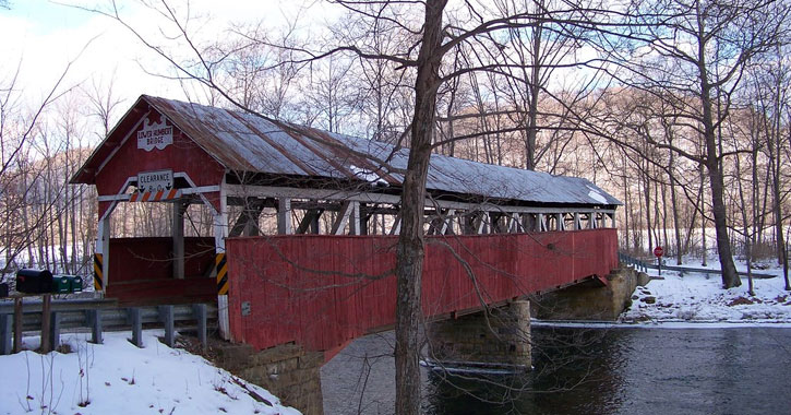 red covered bridge in Laurel Hill Creek Pennsylvania